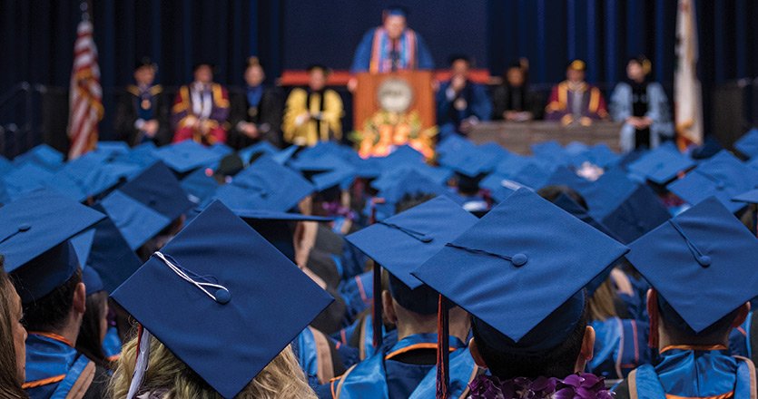 Graduate students receive degrees at graduation