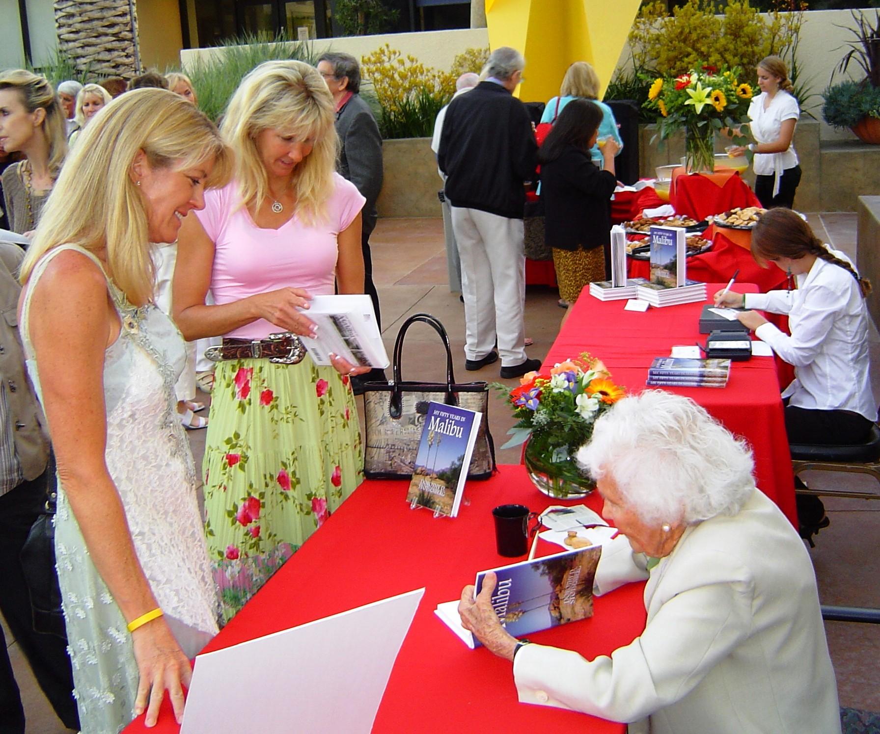 Crest Board member Dorothy Stotsenberg signs her book, 50 Years in Malibu