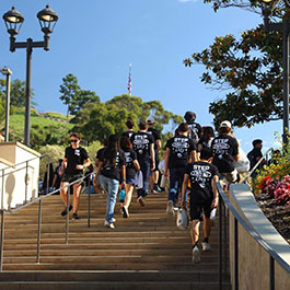 Students leaving campus for a service project