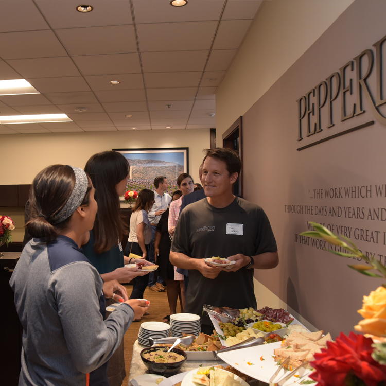 Staff members chat in the new president's suite