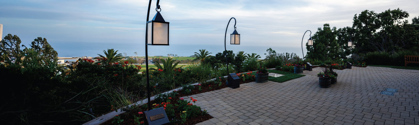 four lighted lanterns at Staufer Chapel overlooking the ocean