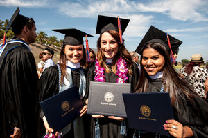 Students pose for pictures at graduation - Pepperdine University 