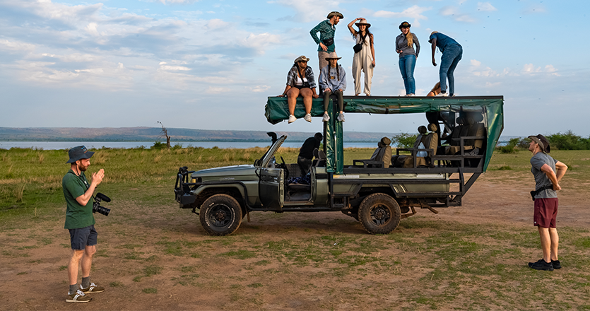 International students sitting on a truck in uganda