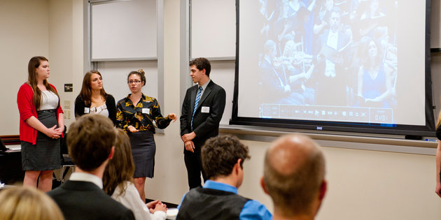 Students give a presentation in front of a class - Pepperdine University