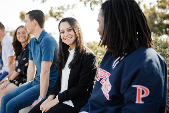 students sitting outside and talking