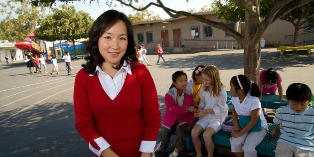 A woman works with young children at an elementary school - Pepperdine University