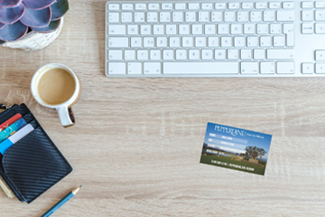 alumni id card on a desk with keyboard