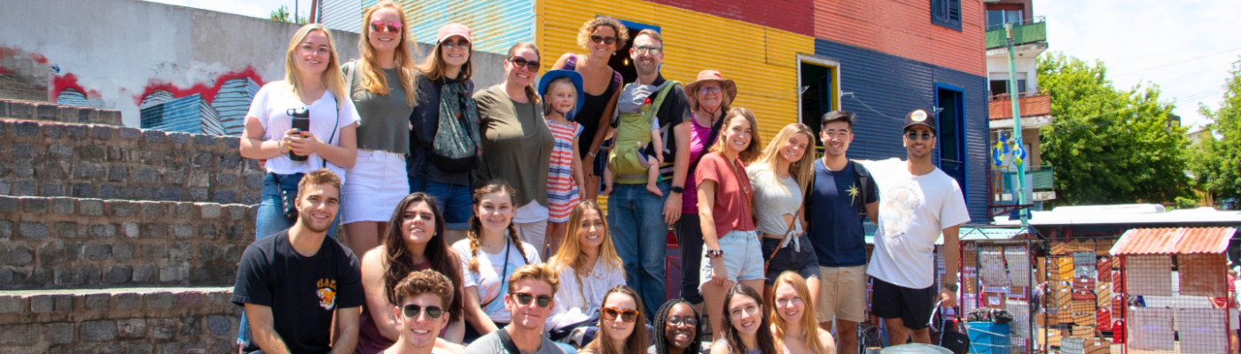 Students gather in front of colorful building in Buenos Aires
