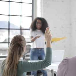 female raising hand