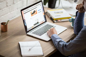 Man typing on laptop