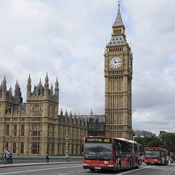 street view of Big Ben with buses and tourists