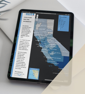 A tablet shows the improved and expanded capabilities of Salus technology in tracking COVID-19.