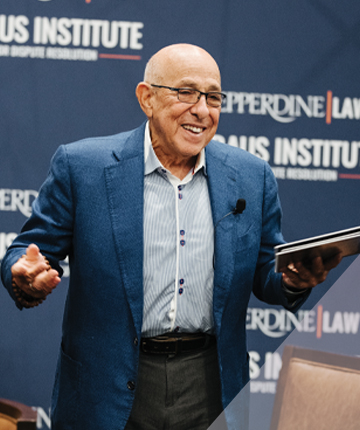 The Honorable Daniel Weinstein (Ret.) presenting his gift to the Straus Institute for Dispute Resolution with Dean Paul Caron.