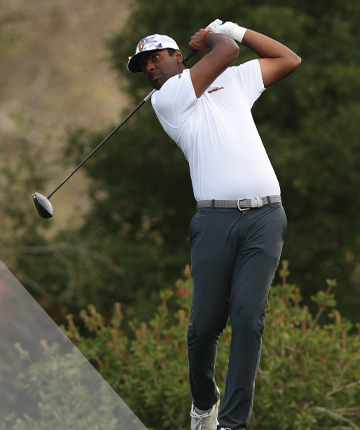 Sahith Theegala golfing on a green.