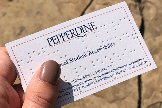 The new Pepperdine business cards featuring Braille embossment.