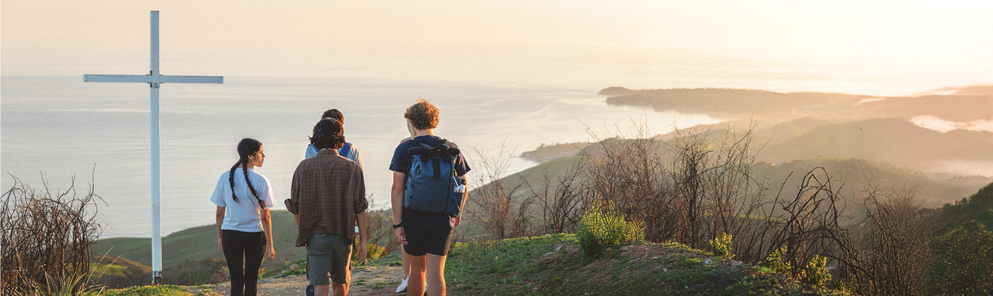 Students hiking to the Pepperdine University Cross