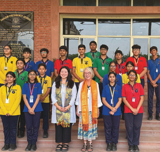 Teachers and Student posing for Photo