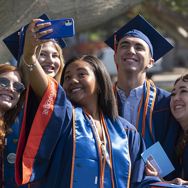 Graduates taking selfie