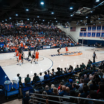 Pepperdine basketball court with players and crowd in stands