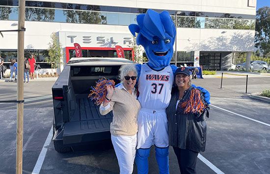 People with Willie the Wave at a Tesla event