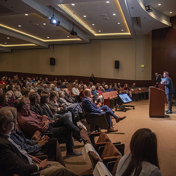 speaker talking to crowd at conference