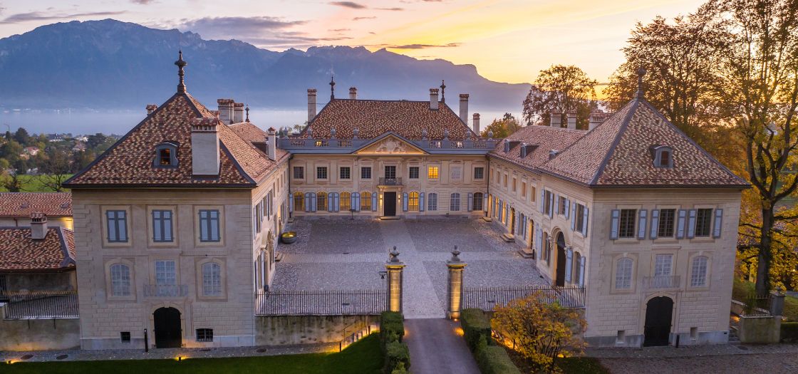 Aerial view of the Chateau at sunset with Lake Geneva in the background