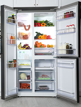 refrigerator opened with food inside