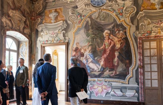 Grand Salon with people standing inside looking at Italian frescoes