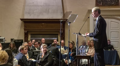 Speaker speaking to a crowded room