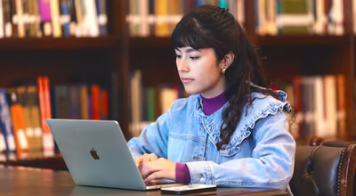 student with a laptop