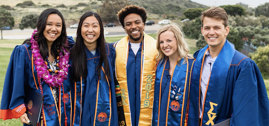 Seaver graduates with caps and gowns