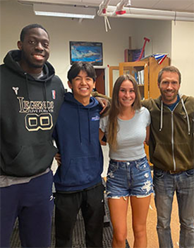 Akin Akinwumi with Dr. Hunter Paris and other students