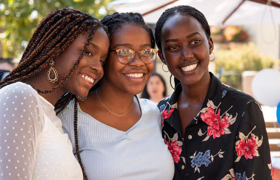 Three female students are smiling at camera - Pepperdine University