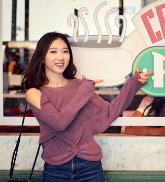 Student ambassador Beth Sun pictured in front of a Central Perk sign