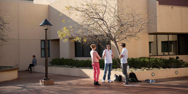 A group of international students speak on campus - Pepperdine University