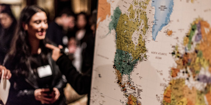 Female student looking at a world map