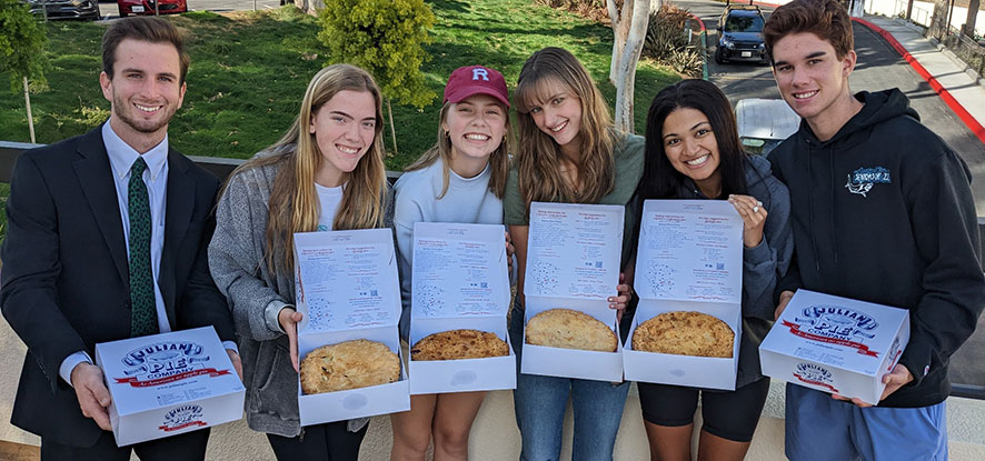 Seaver students holding Julian pies