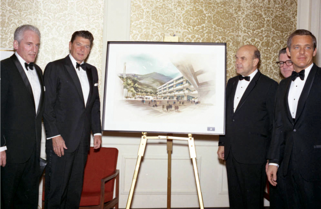 Former President and Governor Ronald Reagan and Pepperdine supporters with rendering at Birth of a College gala in 1970