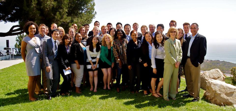 Pepperdine faculty and student pose together on the lawn