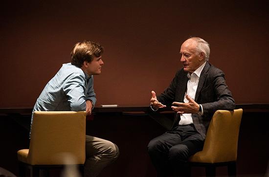 Two men are speaking