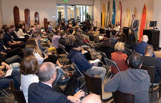 attendees sitting listening to a panel discussion