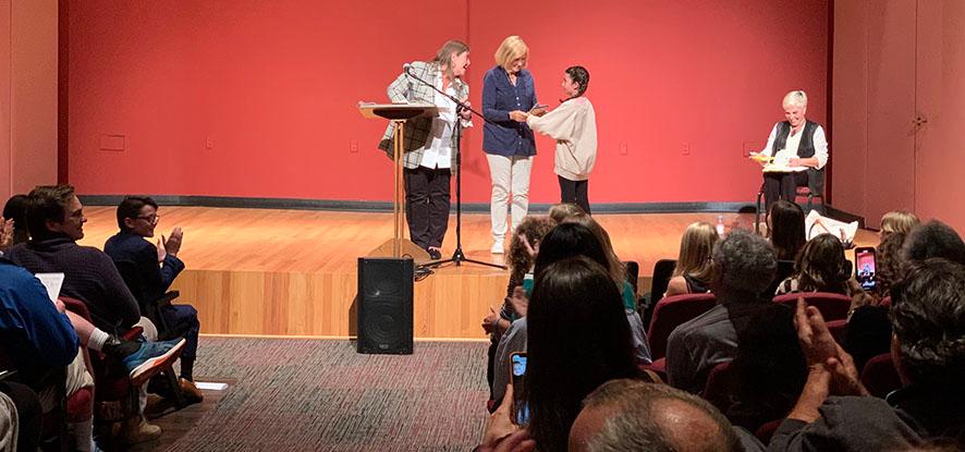 people on stage at Center for the Arts