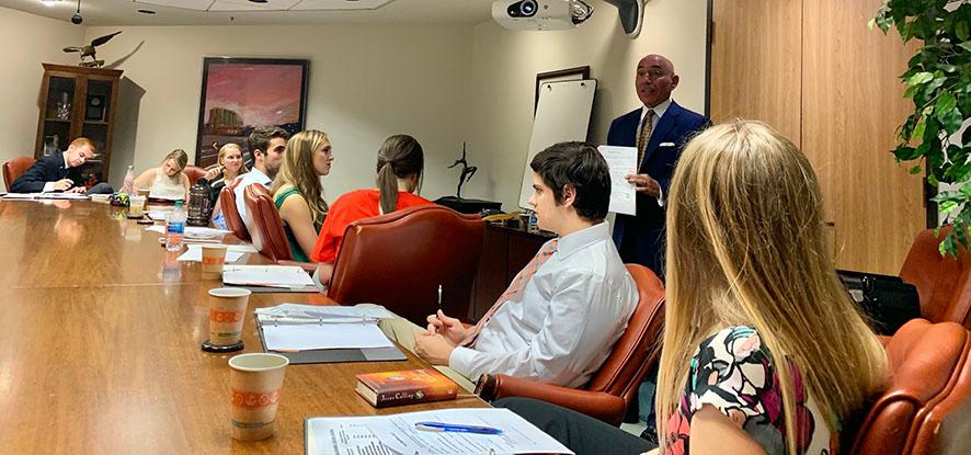 people sitting around a table at a workshop
