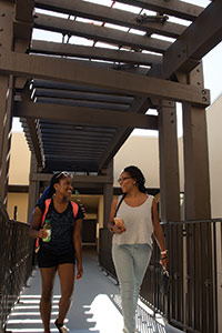 Students walking through Seaside Residence Hall - Pepperdine University