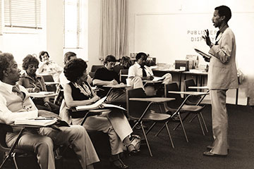 Students sit in a classroom and listen to a lecture