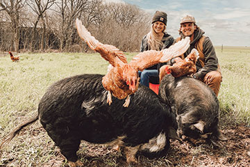 Kacie Scherler and husband on farm