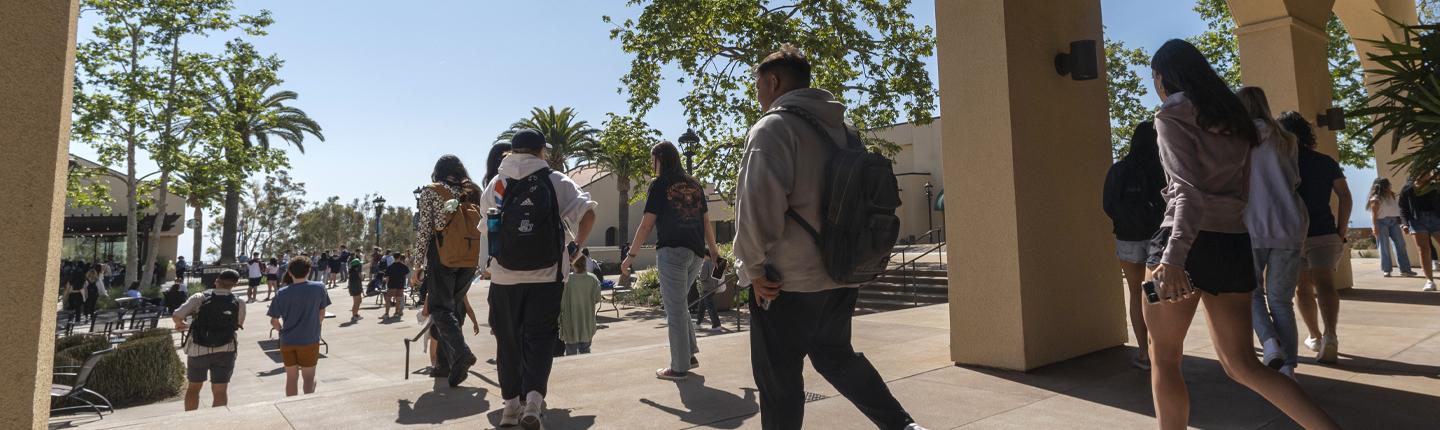 Students Walking at the Campus Quad