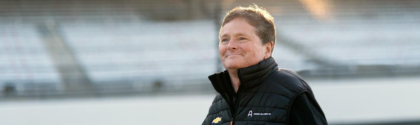 Sam Schmidt standing in a stadium in the Arrow suit