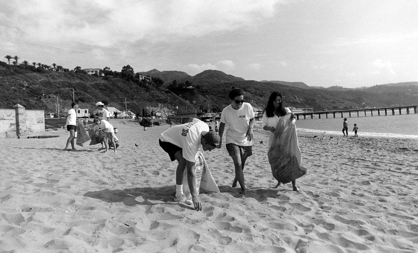 Students participate in a beach cleanup alongside the Malibu Pier. 