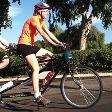 Christine Tinberg on bicycle - Pepperdine Magazine